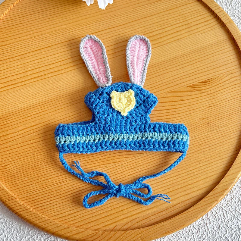 Small dog wearing blue bunny knit pet hat