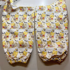Yellow honey bear print dog elbow guard sleeves flat lay
