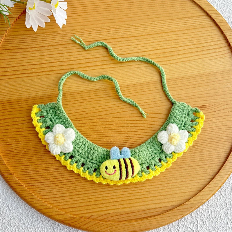 Close-up of artisan honeybee knit pet collar in green