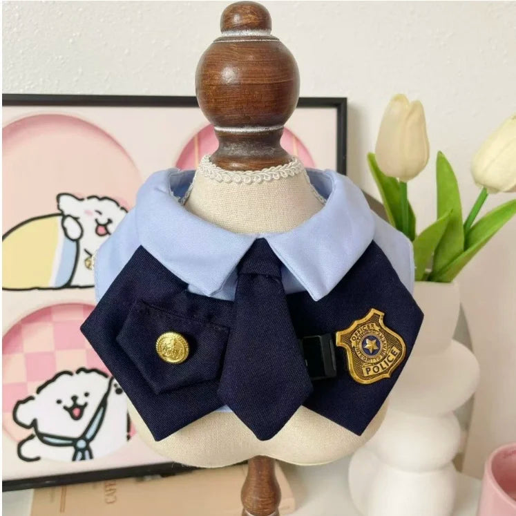 Closeup of officer-style pet bib collar with gold-tone button and badge charm